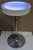 Round Battery Powered LED Table  white shown in lighted room